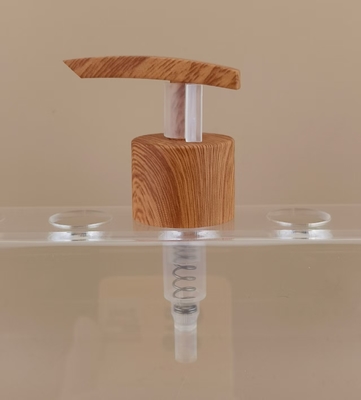 Bomba dispensadora de grano de madera plástica para loción K1104 para botellas