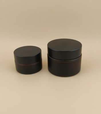 Bonito diseño Vidrio negro Jarrón de crema con tapa de tornillo para loción