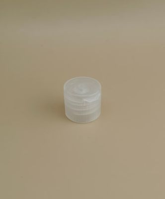 Tapa de plástico pequeña, transparente, redonda y estriada para botellas de cosméticos