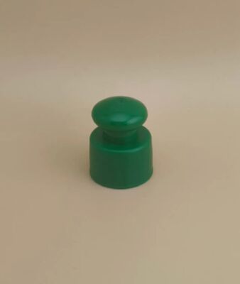 Tapa lisa de plástico verde con botón para botellas cosméticas