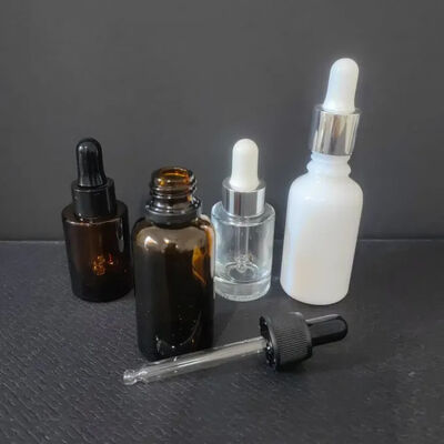 Vidrio personalizado hombro inclinado 1 oz Pelo Ojo Esencia Esencial Embalaje Sero para el cuidado de la piel Botella de 30 ml Botella de gotero congelada con caja
