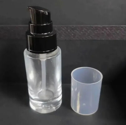 Maquillaje Paquete Loción para el cuidado de la piel Botella cilindro Botellas redondas de bomba de vidrio para el cuidado de la piel