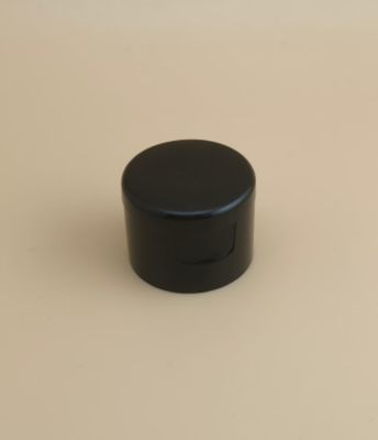 Tapa redonda de plástico negro lisa para botellas cosméticas