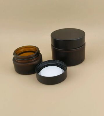 Bonito diseño Vidrio negro Jarrón de crema con tapa de tornillo para loción