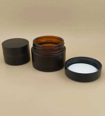 Bonito diseño Vidrio negro Jarrón de crema con tapa de tornillo para loción