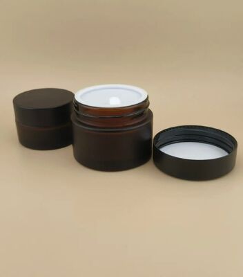Bonito diseño Vidrio negro Jarrón de crema con tapa de tornillo para loción