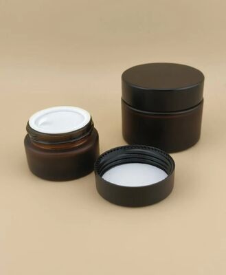 Bonito diseño Vidrio negro Jarrón de crema con tapa de tornillo para loción