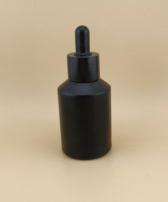 Flasca de vidrio negro de diseño delicado para la esencia facial
