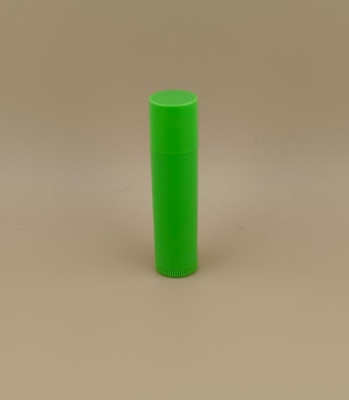 Embalaje pequeño de bálsamo labial verde suave con tapa rosa para lápiz labial