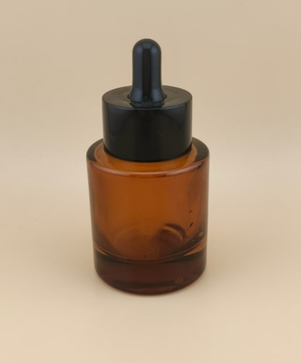 Diseño delicado, botella cuentagotas redonda, lisa y transparente de color marrón para esencia