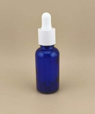 Diseño delicado Botella de goteador redonda lisa y clara de color azul oscuro para el cuidado de la piel