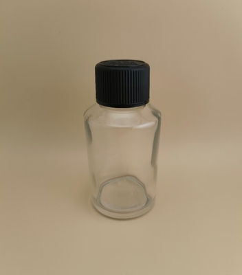 Diseño delicado Botella de vidrio redonda lisa y clara con tapa especial para medicamento