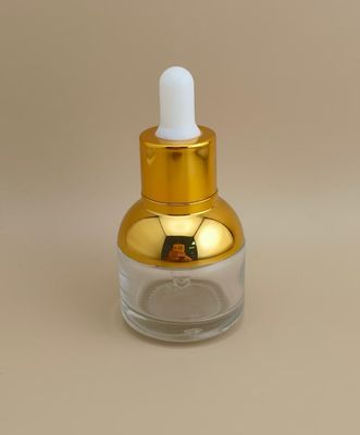 Hermosa botella redonda transparente con gotero para esencia