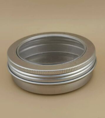 Gran caja de aluminio plateado con tapa de tornillo transparente para cosméticos